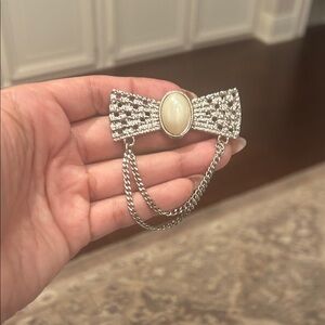 Elegant Silver and Cream Brooch with Chain